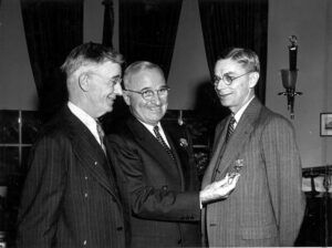 <img src="Truman,Bush, Conant.jpg" alt="Vannevar Bush and President Truman celebrate how science supports democracy. ">
